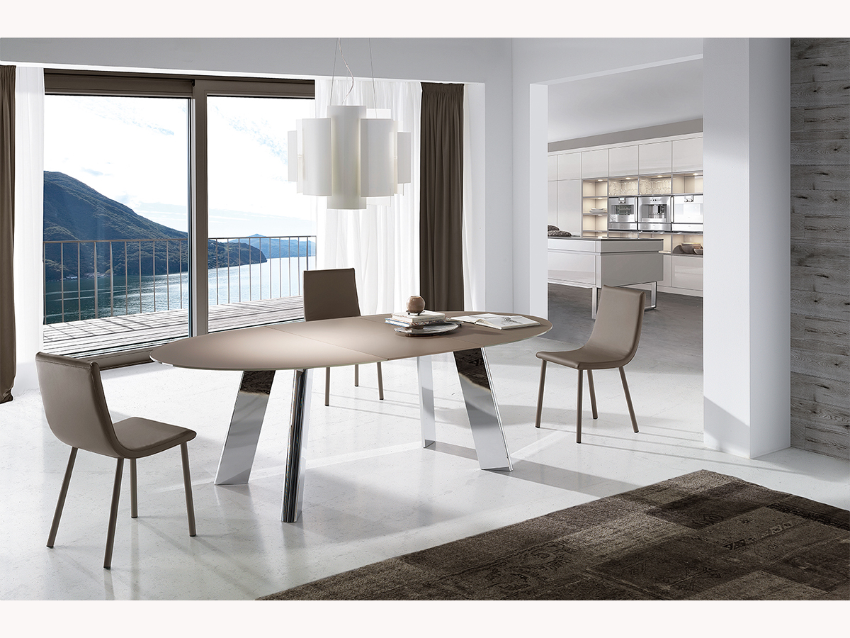 mesa comedor de diseño moderno, extensible de metal y cristal. ramiro tarazona.